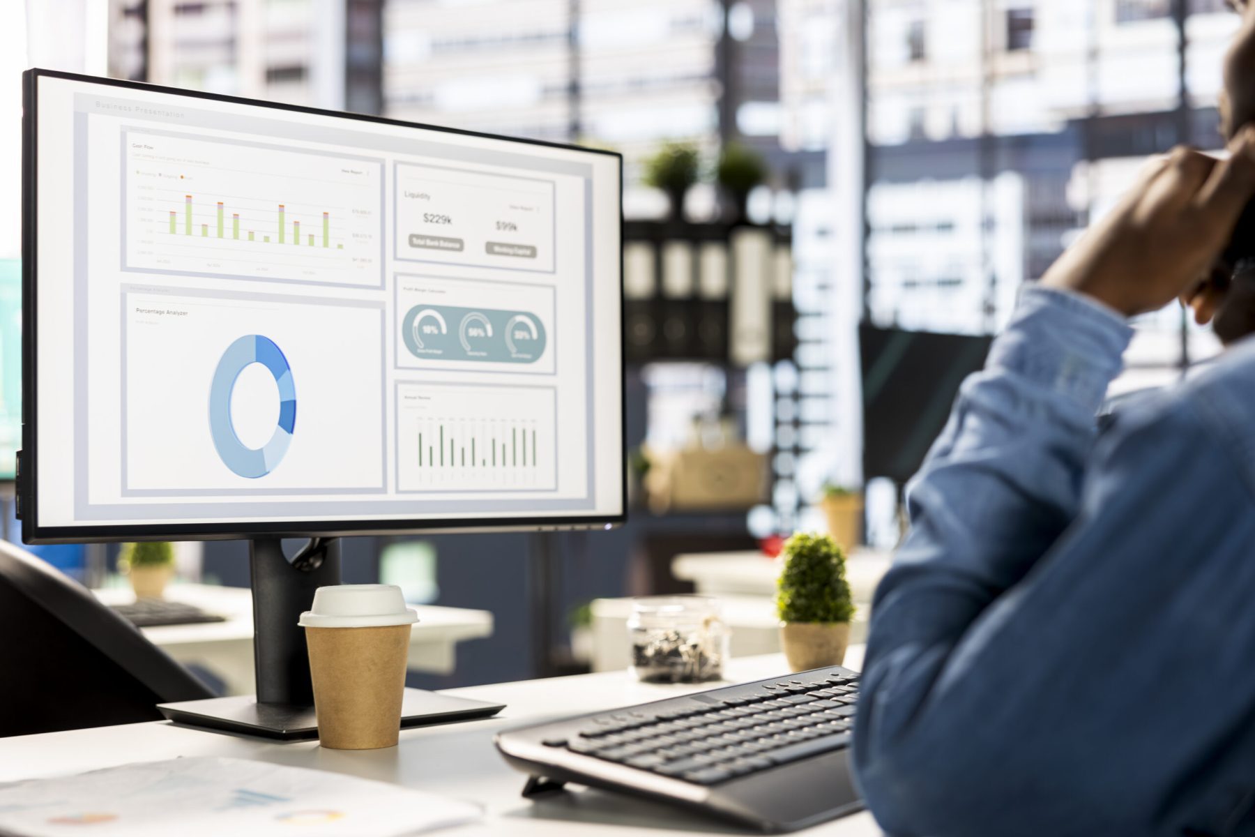 businessman studying infographics performance metrics scaled